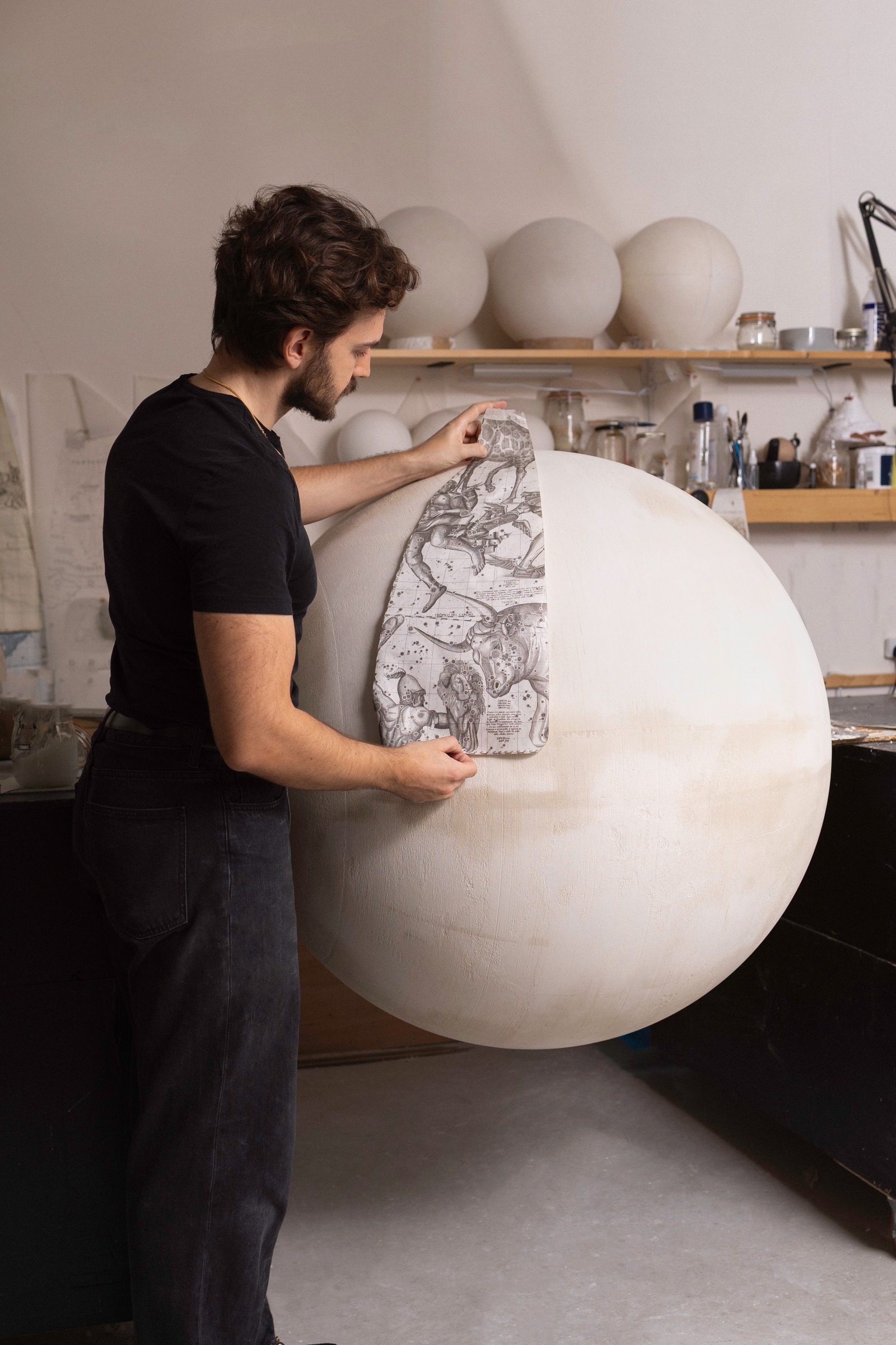 Leonardo Frigo applying a printed constellation gore to the 108 cm plaster sphere